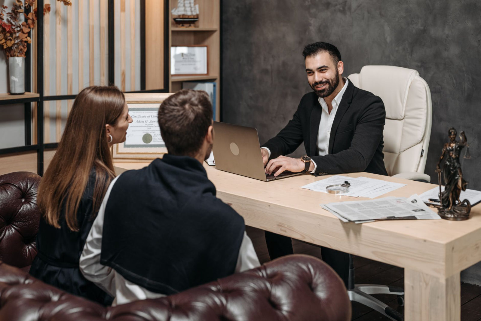A lawyer consulting with clients in a modern California law office — illustrating how to get more personal injury or family law clients using SEO in California