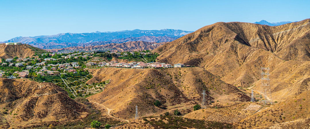 Aerial panoramic view of Santa Clarita CA hills and neighborhoods, illustrating how many referring domains do local business competitors have in Santa Clarita CA and the competitive landscape gap between top-ranking businesses