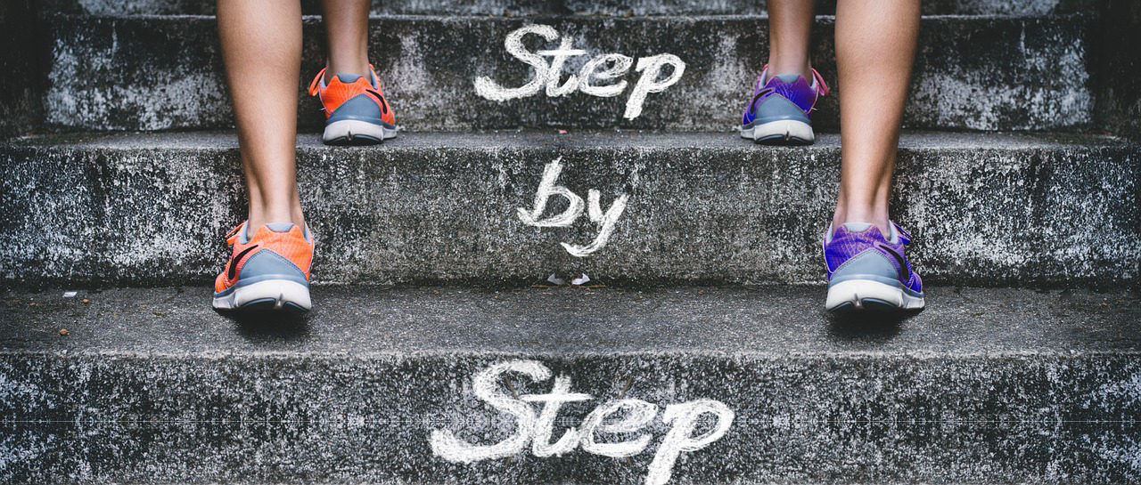 Feet climbing concrete steps with 