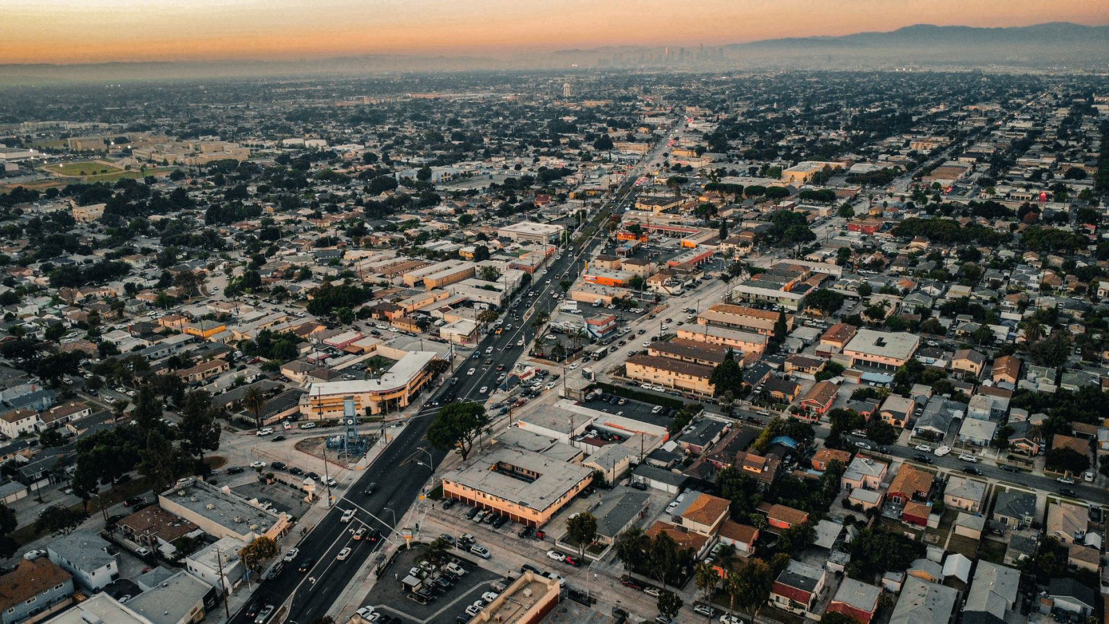 Aerial sunset view of a dense Los Angeles County neighborhood, illustrating the local landscape for low cost local marketing ideas for small business in Los Angeles County